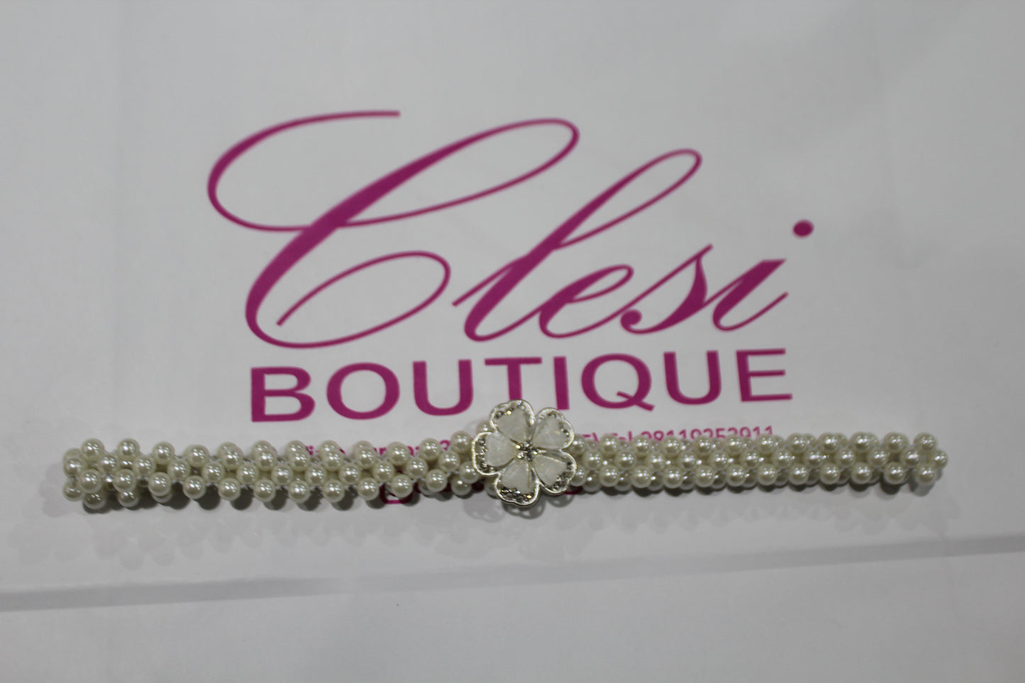 Cintura con fibbia a fiore